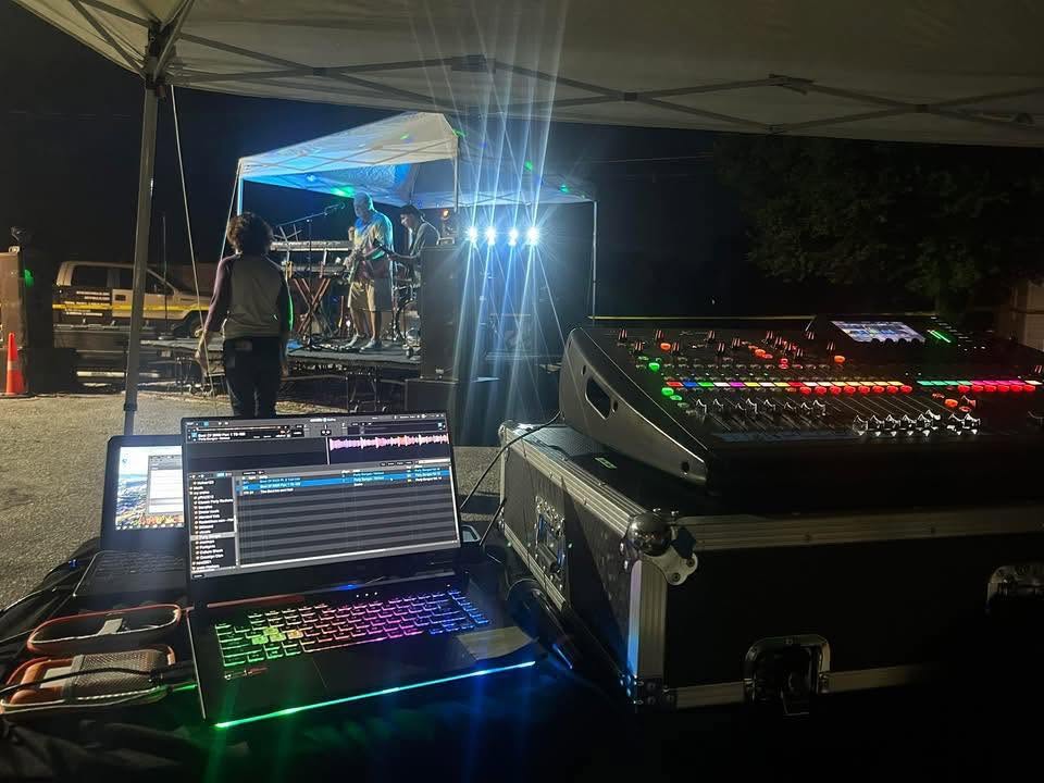 Line-array PA speakers and subwoofers rigged on stage