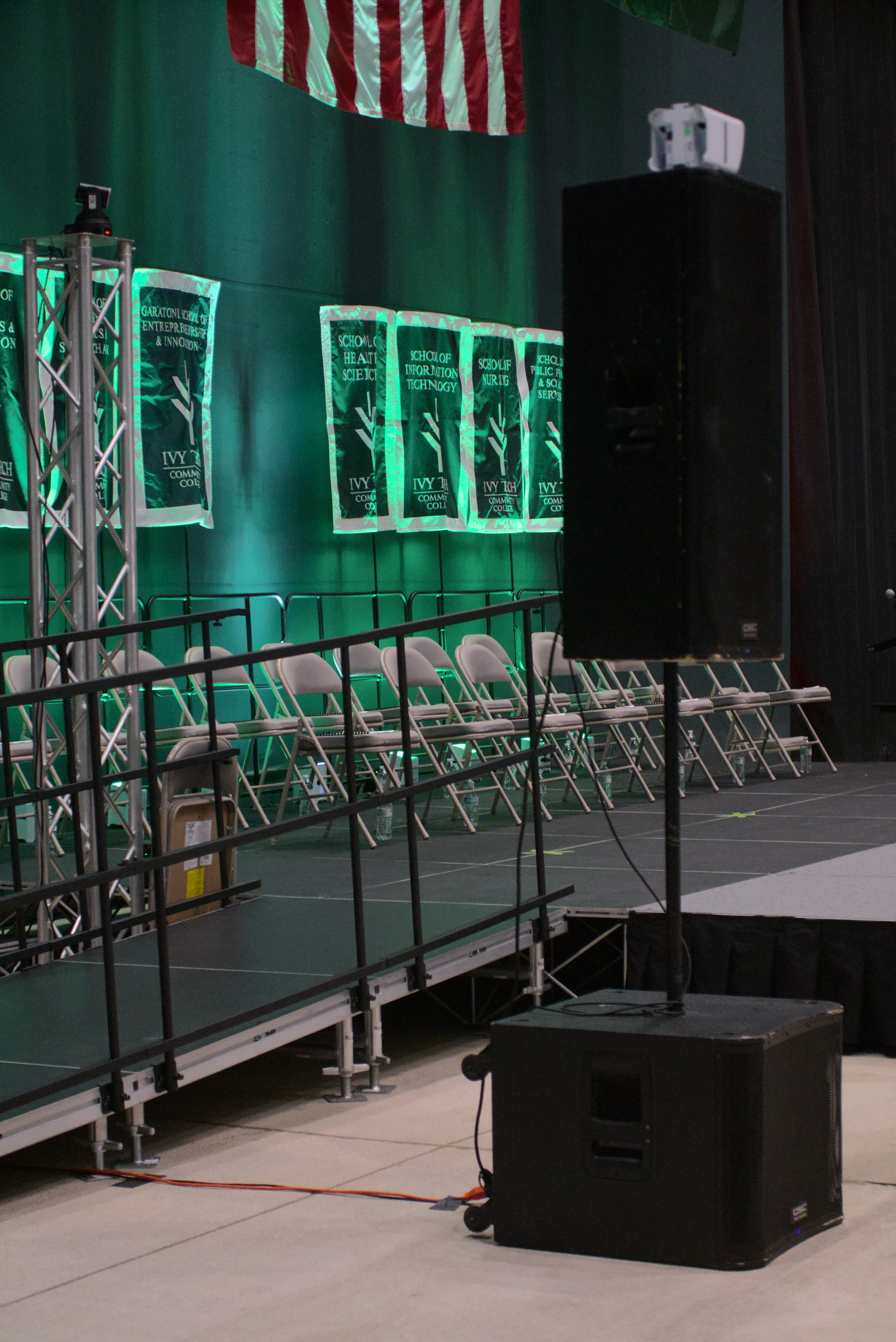 Stage with subwoofer speakers and truss